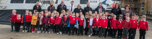 School children in front of hovercraft