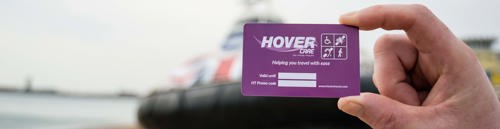 Person holding purple hovercare card in front of hovercraft