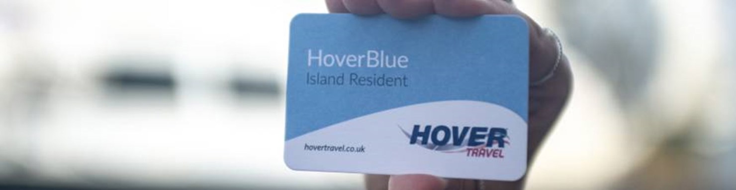 Hand holding up blue hovertravel card