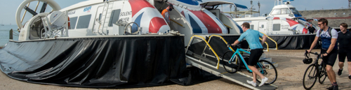 Cyclists boarding a hovercraft